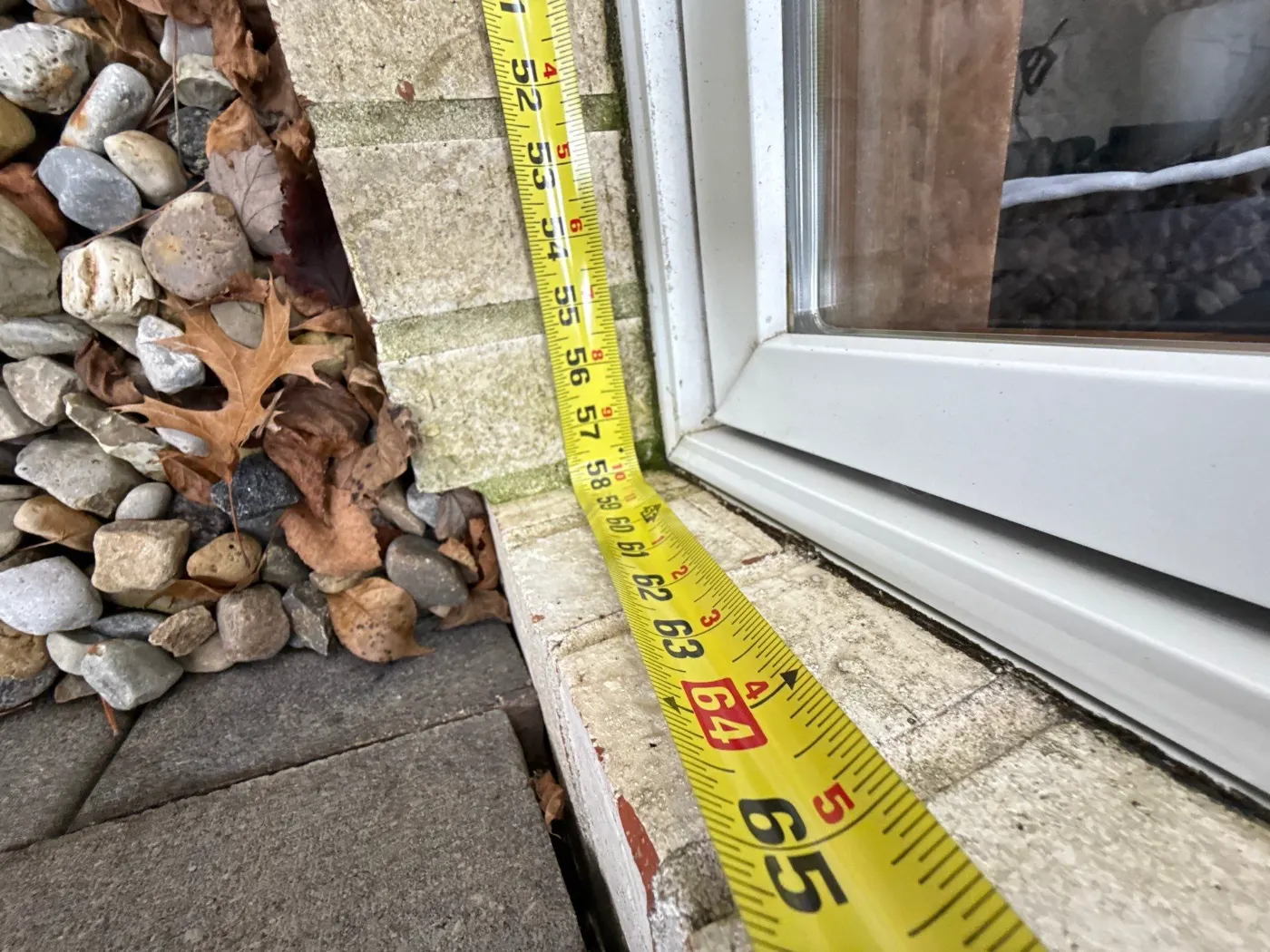 Storm-damaged window documented in Raintree Village